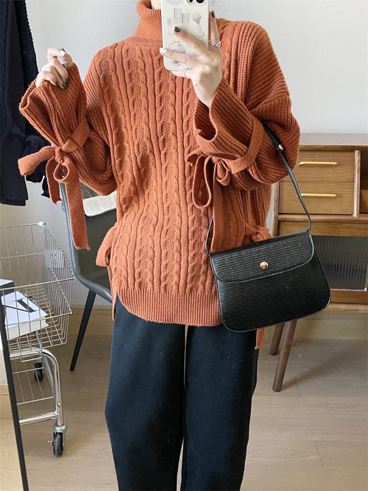 袖リボンケーブル編みタートルネックセーター